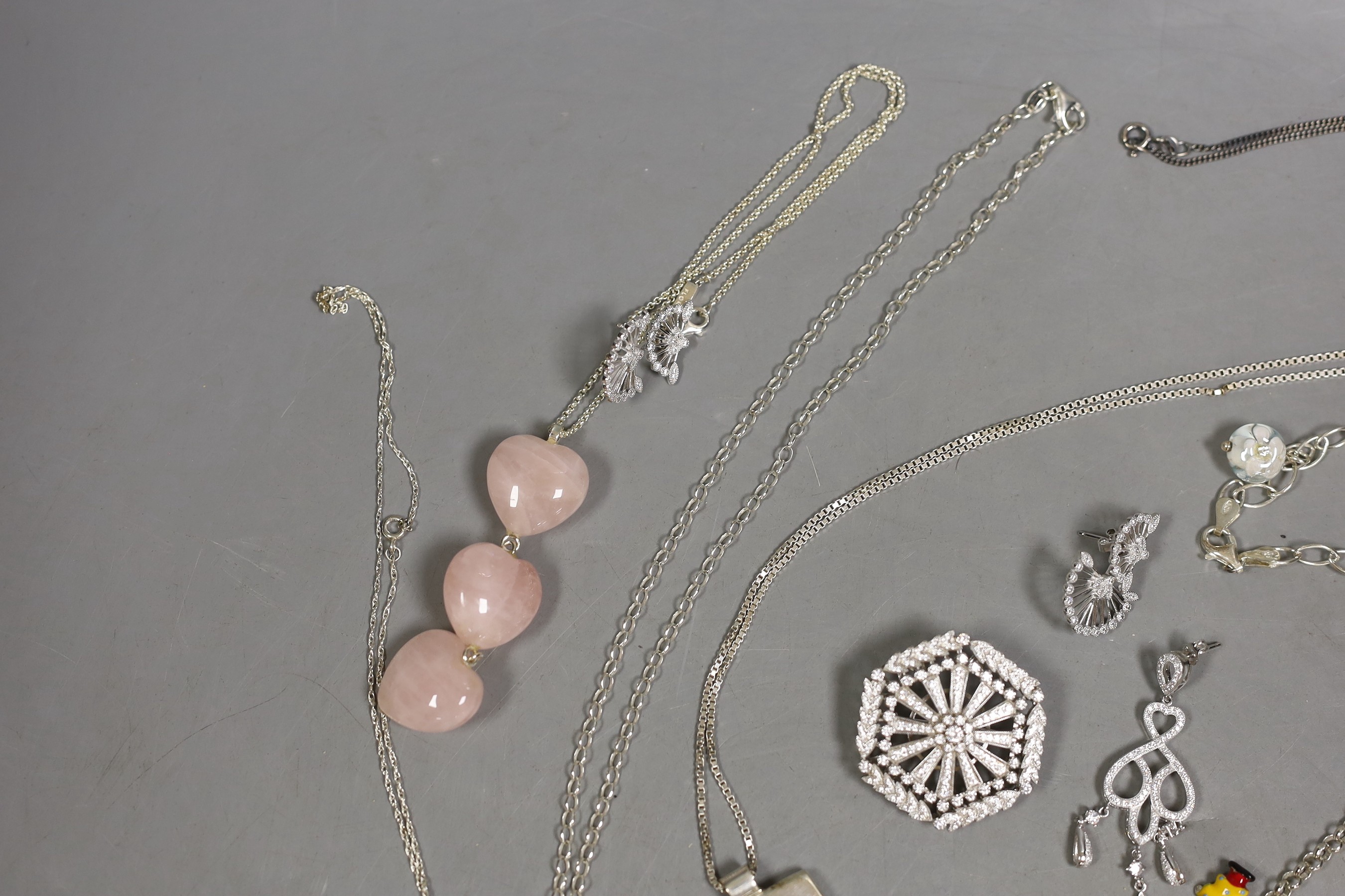 Assorted modern jewellery including four 925, paua shell, freshwater pear and CZ brooches, three assorted pairs of 925 ear studs, a 925 and rose quartz pendant and matching pair of earrings, two pairs of 925 and CZ earri